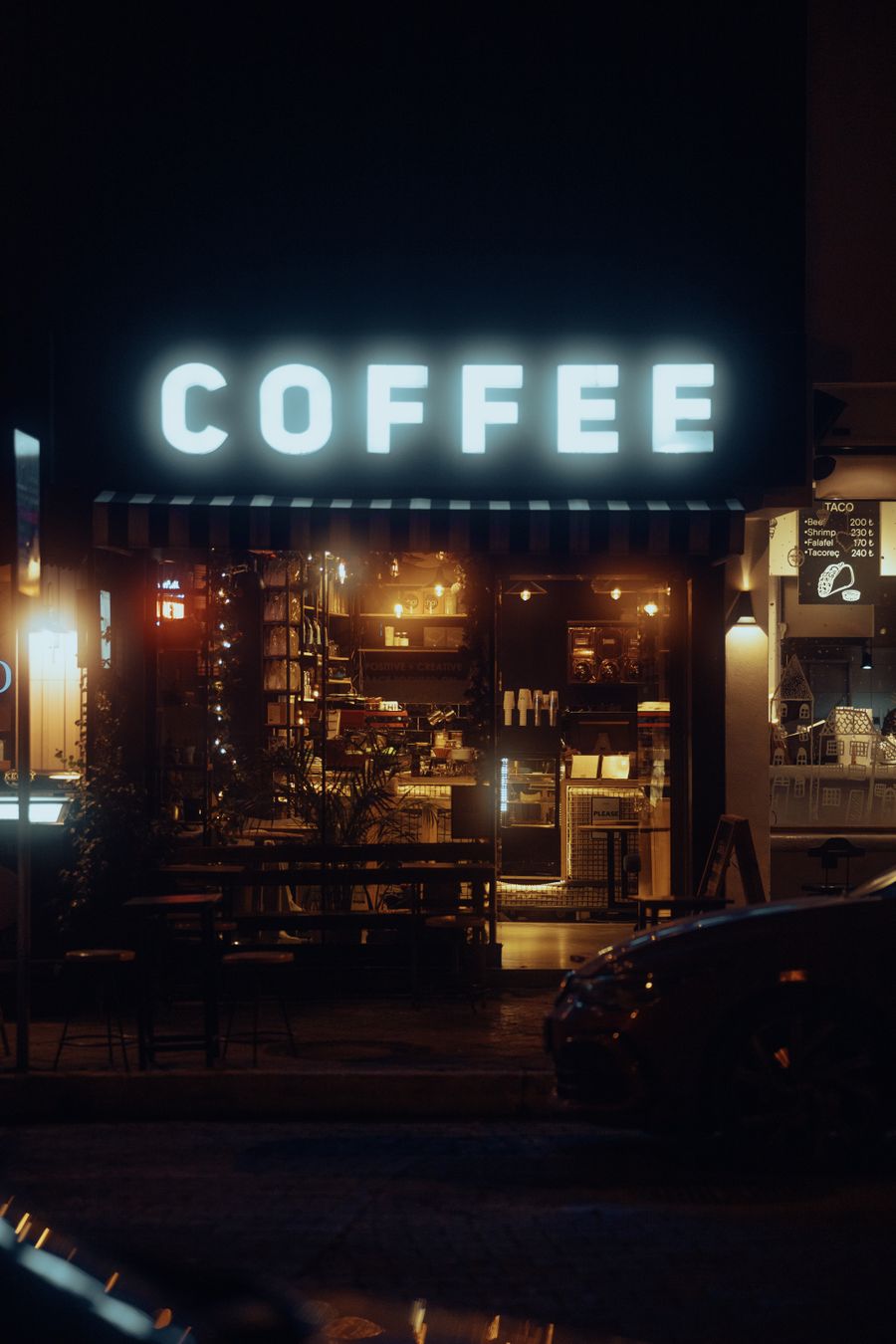 Coffee shop with a neon sign at night